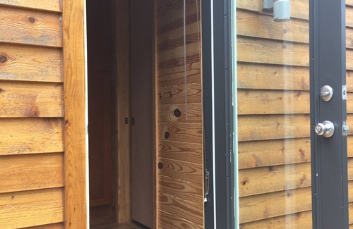 West Jefferson House | Tiny House On Wheels across from New River