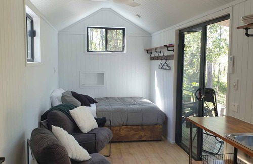 Bollier Cabin | Tiny in The Treesn- Cute, Spacious Tiny House set privately amongst the trees.n