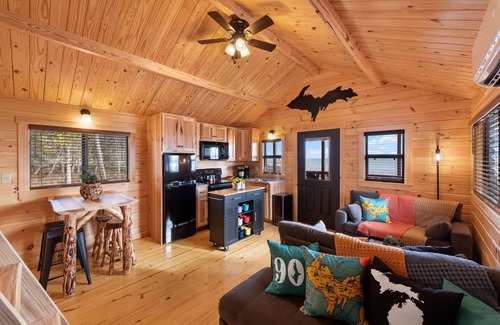 Escanaba Cabin | Tiny Log Cabin on Lake Michigan Shore Full Week Rental
