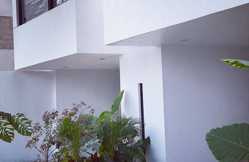 Tizimin House | Tizimín retreat: stylish townhouses, natural harmony, modern comforts.