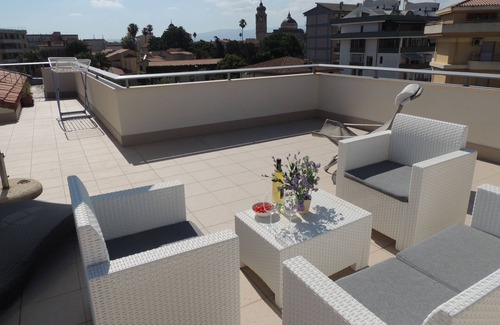 Oristano Apartment | Top floor penthouse apartment with terrace in the historical center, 3 km from the beach