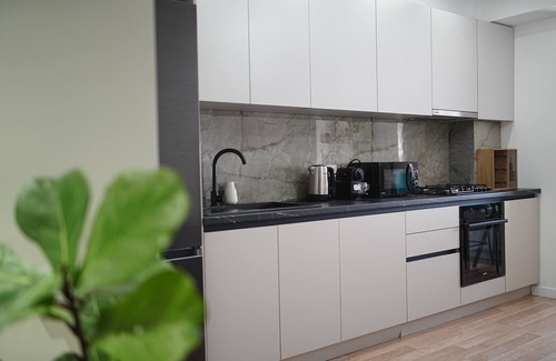 Riscani Apartment | Top Spot in Riscani! 1BR Near Shops & Restaurants