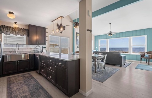 Fort Morgan House | Totally renovated 4 bedroom, 3 bath gulf front home with nice covered deck and large sun room.