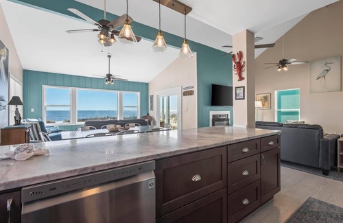 Fort Morgan House | Totally renovated 4 bedroom, 3 bath gulf front home with nice covered deck and large sun room.