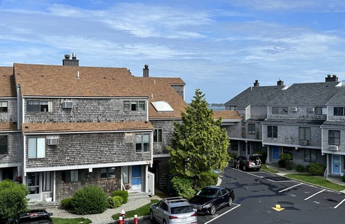Hyannis House | Townhouse less than one-minute walk to a private beach and heated pool on site
