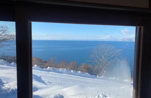 Toyako Apartment | Toya Cliff House Modern Kominka (Japanese style house) with spectacular ocean.