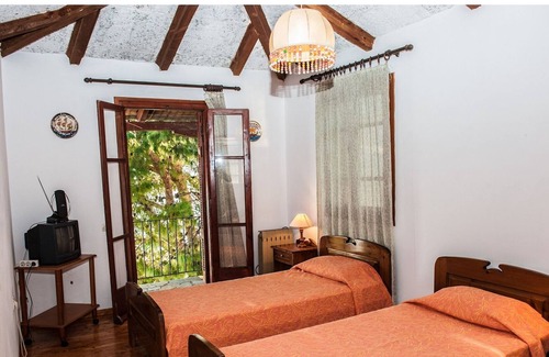 Paleros Villa | Traditional, rustic, seafront villa, just steps away from the beach.