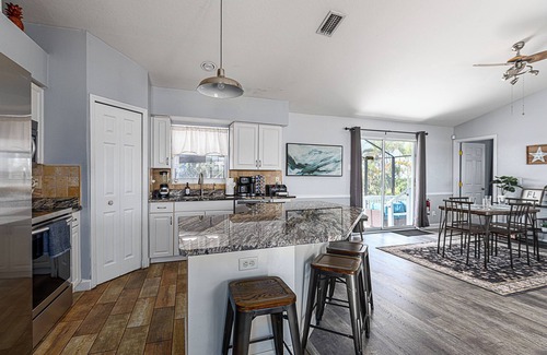 Jacarandas House | Tranquil 6-bedroom house with AC, heated pool, and plenty of space in Cape Coral