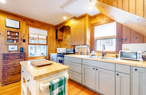 Raymond Cottage | Tranquil cottage near beach with private dock, spacious patio & modern comforts