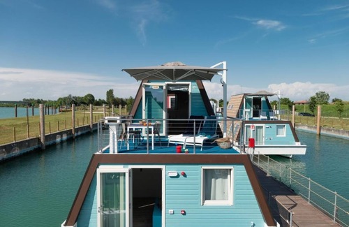 Lignano Sabbiadoro Boat Rental | Tranquil Marina Azzurra Resort House boat 2BR sleeps 6