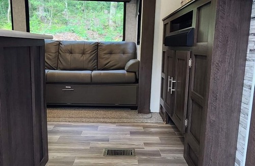 Mill Spring House | Travel trailer near the creek, short walk to pool and playground, sleeps 8.