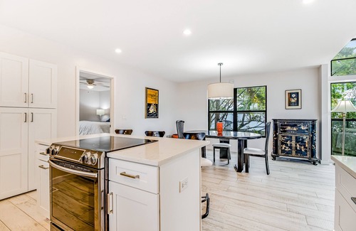 Longbeach Village House | Tree-lined home w/amazing decor & screened porch - near beach/dining