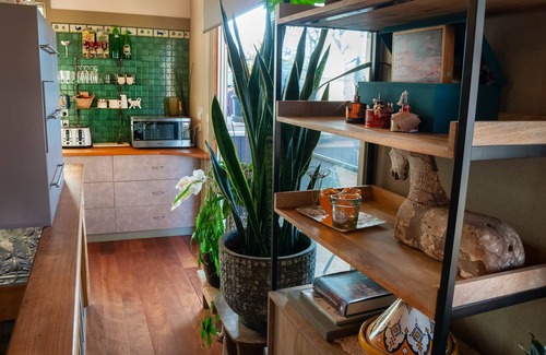 Tawonga South Apartment | Tree Tops Apt @ Dreamers features log fire, mountain + pool views thru tree tops