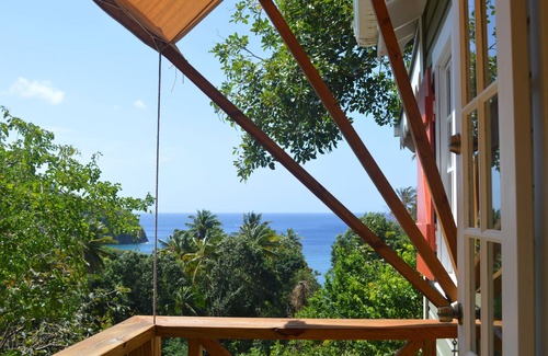 Toucari Cottage | Treetops. A beautiful timber cottage, sea view, private and close to the beach.