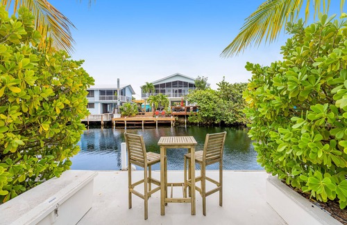 Indian Waterways House | Trendy canal-front home with dock, full kitchen, central AC, & washer/dryer