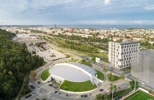 Witomino Apartment | Trendy Modern Tower Apartment with Private Parking Space