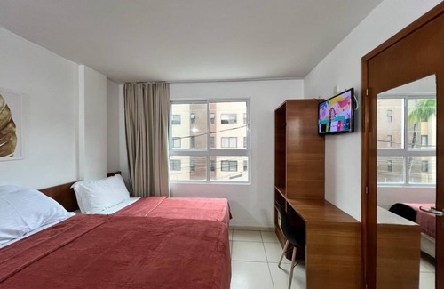 Cabo Branco Hotel | Triple suite with side sea view