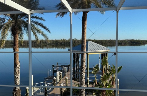 Mid Island House | Tropical breezes, dolphins, sea birds, fragrant flowers, and expansive bay views