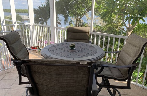 Mid Island House | Tropical breezes, dolphins, sea birds, fragrant flowers, and expansive bay views