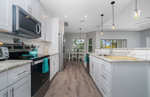 Englewood East House | Tropical Oasis with saltwater pool & hot tub on a canal 8 miles from beaches