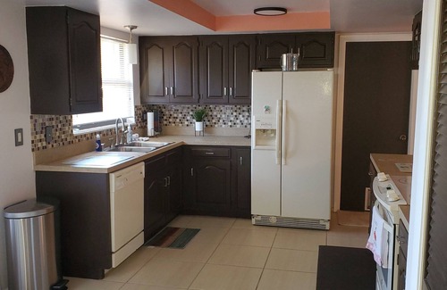 Venice Gardens House | Tropical vacation house with large, heated pool and spacious, open floor plan