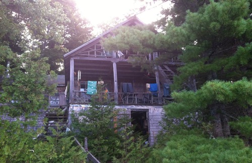 Forest CIty Cottage | Turn Of The Century Cabin On Private Island