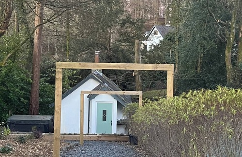 Windermere Cottage | Turn up. Switch off Surrounded by trees with stream nearby, perfect escape for 2