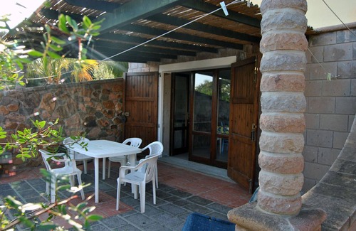 Sant'Antioco Villa | Two adjoining apartments sleeps 8/10, veranda, barbecue and olive garden