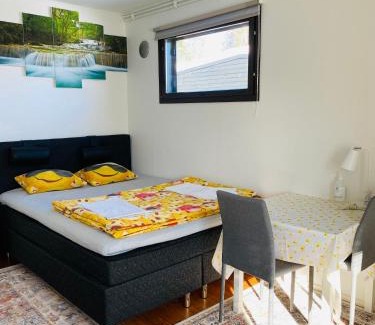 Kotka House | two bedrooms,dining area and bathroom with private entrance