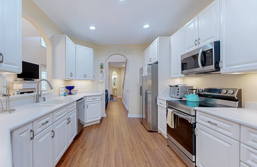 The Commons House | Two-level Bayside Resort house with heated pool, hot tub, fireplace & AC