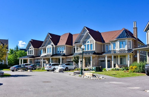 The Blue Mountains Condo | Two-story condo with patio, fireplace, grill, & heated pool - dog-friendly