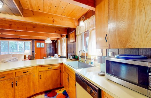 Comstock Acres Cabin | Two-story dog-friendly cabin with a wood fireplace, washer/dryer, & decks