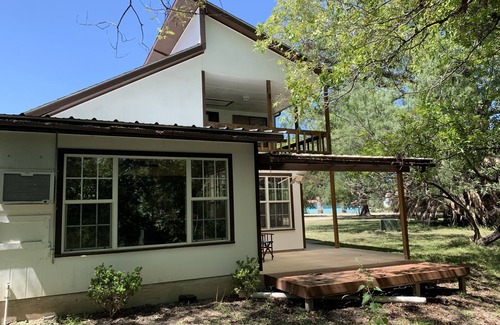 Brackettville House | Two story home with Las Moras Creek views