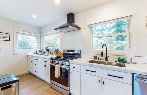 Everett House | Two-story home with spacious yard, washer/dryer & central AC- dog-friendly
