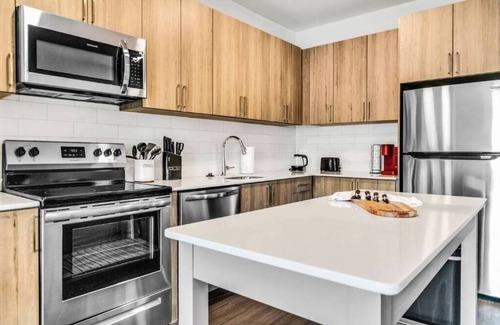 McLean Apartment | "Tysons' Blue-Gray Haven Stylish 2BR with Amenities + Huddle Rooms + Pool/Gym