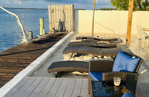 Alice Town Cottage | Unique, authentic, exquisite waterfront cottage with a dock.