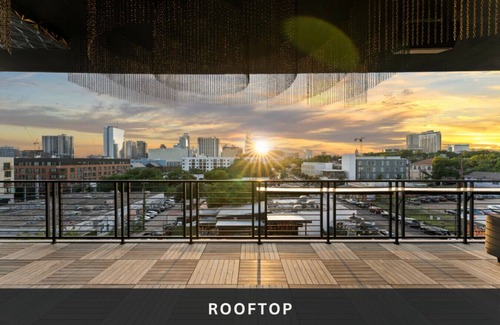 East Cesar Chavez House | Unit 2+3 Inn Cahoots on 6th: 10BR/26 Bed - Pool, Roofdeck, Garden Bars, Walk To Everything!