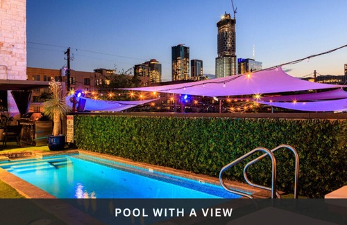 East Cesar Chavez House | Unit 2+3 Inn Cahoots on 6th: 10BR/26 Bed - Pool, Roofdeck, Garden Bars, Walk To Everything!