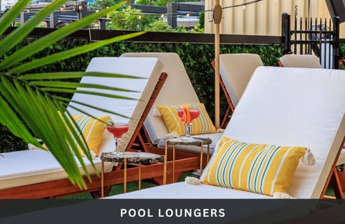 East Cesar Chavez House | Unit 2+3 Inn Cahoots on 6th: 10BR/26 Bed - Pool, Roofdeck, Garden Bars, Walk To Everything!
