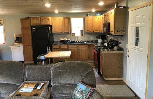 Rapid River House | UP Riverfront Cabin with rustic charm & modern amenities. Great for families!