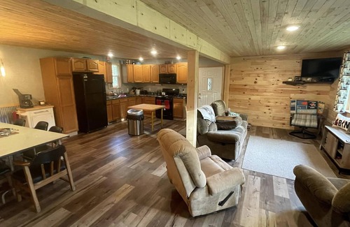 Rapid River House | UP Riverfront Cabin with rustic charm & modern amenities. Great for families!