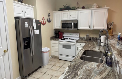Sunset Beach Condo | Updated ground-level 3 BR/2 BA condo beside pool. Golf, Tennis, and family fun.
