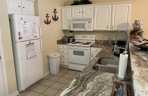 Sunset Beach Condo | Updated ground-level 3 BR/2 BA condo beside pool. Golf, Tennis, and family fun.
