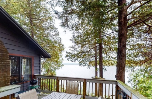Charlotte Cottage | Updated lakefront home in a wooded setting with private dock & beach access