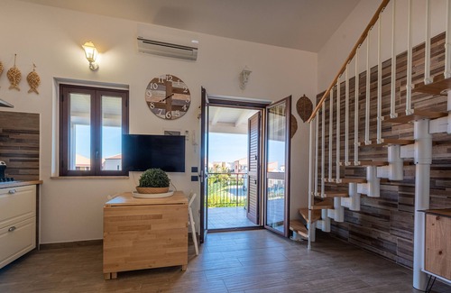 Campofelice di Roccella House | Vacation Home "In Villaggio Centopini" with Shared Pool, 2 Balconies & A/C