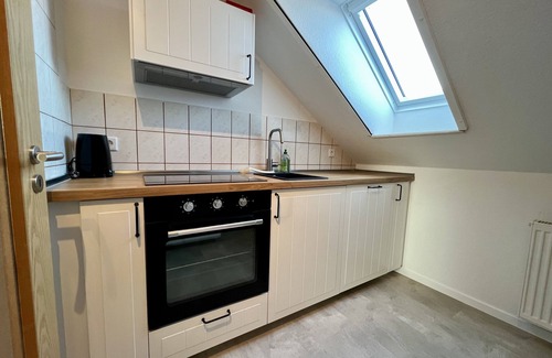 Pilsum Apartment | Vacation apartment "Leuchtturm" with large garden in the heart of Pilsum