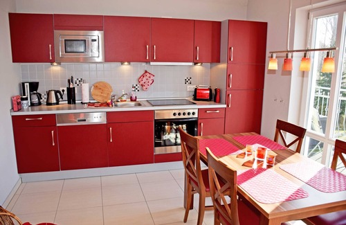 Rugen Island Apartment | Vacation apartment Morgentau with sauna and balcony - manor house apartment with fireplace,