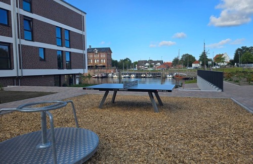 Norden Apartment | Vacation apartment Meeresrauschen on the first floor with garden, sauna and pet
