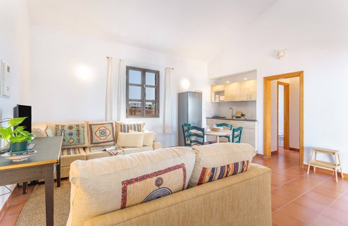 Lajares Apartment | Vacation 'Dragón Y Suerte Lajares Pool' with Mountain View, Shared Pool and Wi-Fi