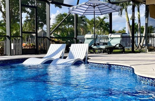 Tropic Palms House | VacationSunwind:Delray Bch home! SW Pool, Fish, Dock, Water front, Close to Bch